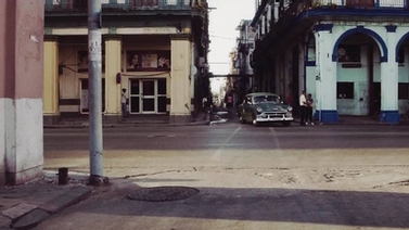 classic car turns a corner in Havana, Cuba