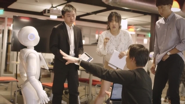 SoftBank employee demonstrates Pepper to Cornell students