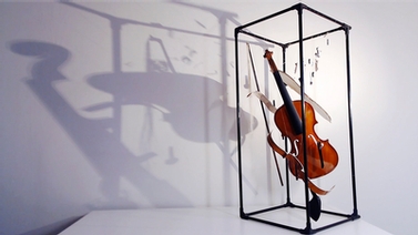 violin casts a shadow on the wall