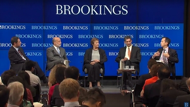 panelists on stage at Brookings