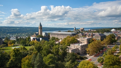 Central campus in summer with Cayuga Lake in background.
