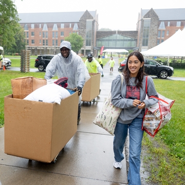 Two students moving in. 