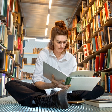 a student reads in the library 