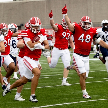 Cornell Football players on the Football field. 