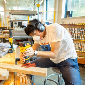 A Cornell student working in woodshop. 