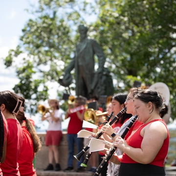 Big Red Band performing in front of Ezra's statue. 