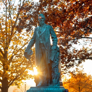 Statue of Ezra Cornell in Fall.