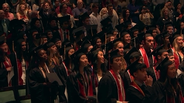 Graduates singing.