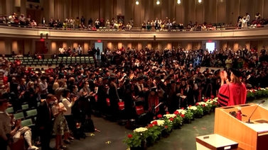 A still-frame from the ceremony showing everyone applauding. 