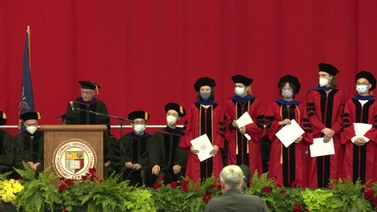 Participants in the graduation ceremony on stage.