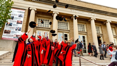 Law School graduates throw their caps in the air