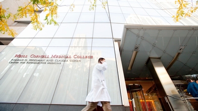 A doctor walking past Weill.